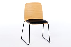 Der Stuhl Manila KU SP mit einer Sitzschale aus Holz Der Stuhl Manila KU SP mit einer Sitzschale aus Holz